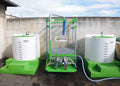 waste water treatment system including treatment and mixing tank, filtration stand, clean water holding tank and diaphragm pump