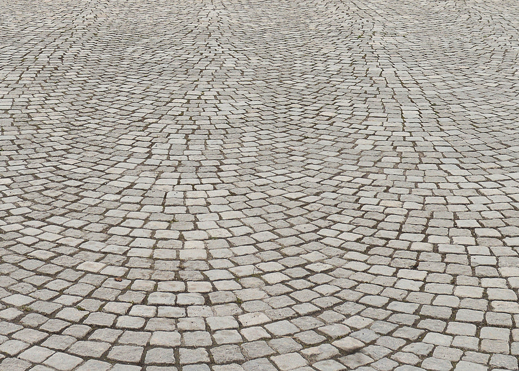 stone sets forming a driveway that has been cleaned with Baticlean CR to keep the surface free from greening and growth.