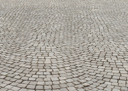 stone sets forming a driveway that has been cleaned with Baticlean CR to keep the surface free from greening and growth.