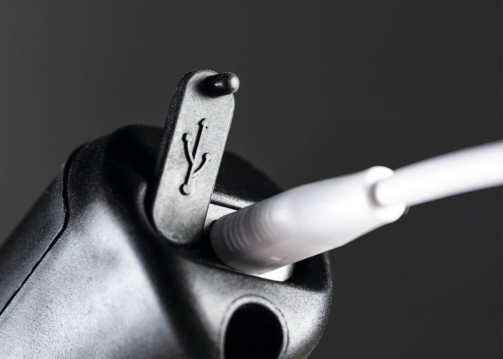 our foaming sprayers are charged via a USB cable that plugs into the bottom of the sprayer handle