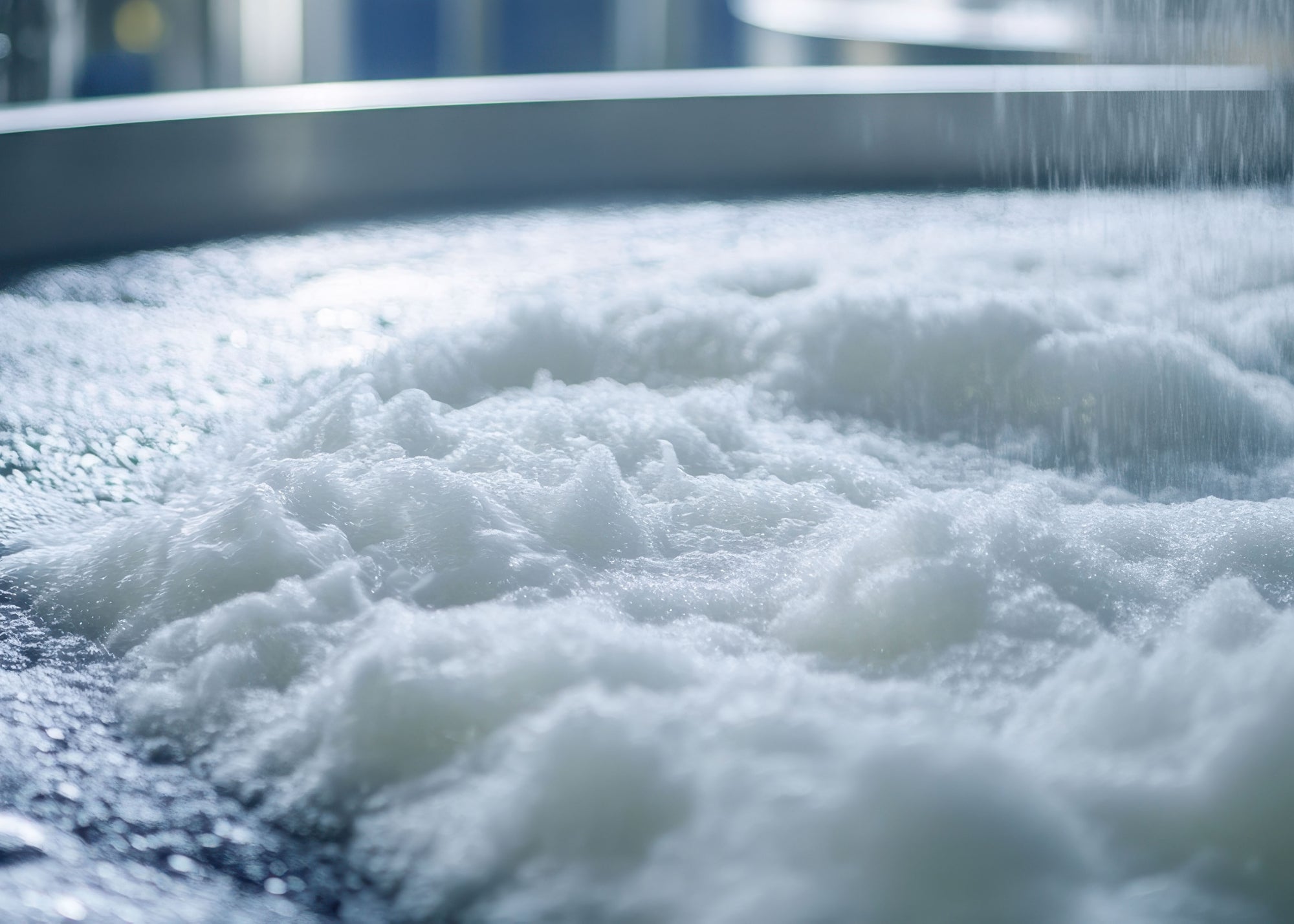 photo showing foam on surface of water tank