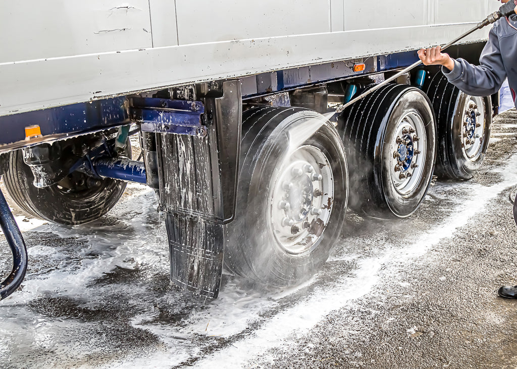 cleaning truck wheels with foaming detergent chemical