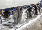 cleaning truck wheels with foaming detergent chemical