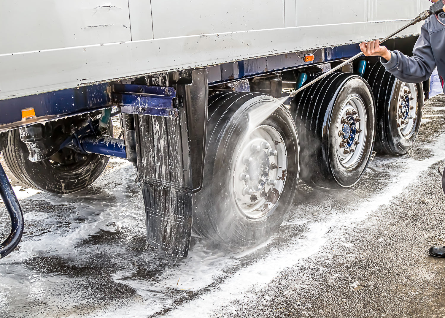cleaning truck wheels with foaming detergent chemical