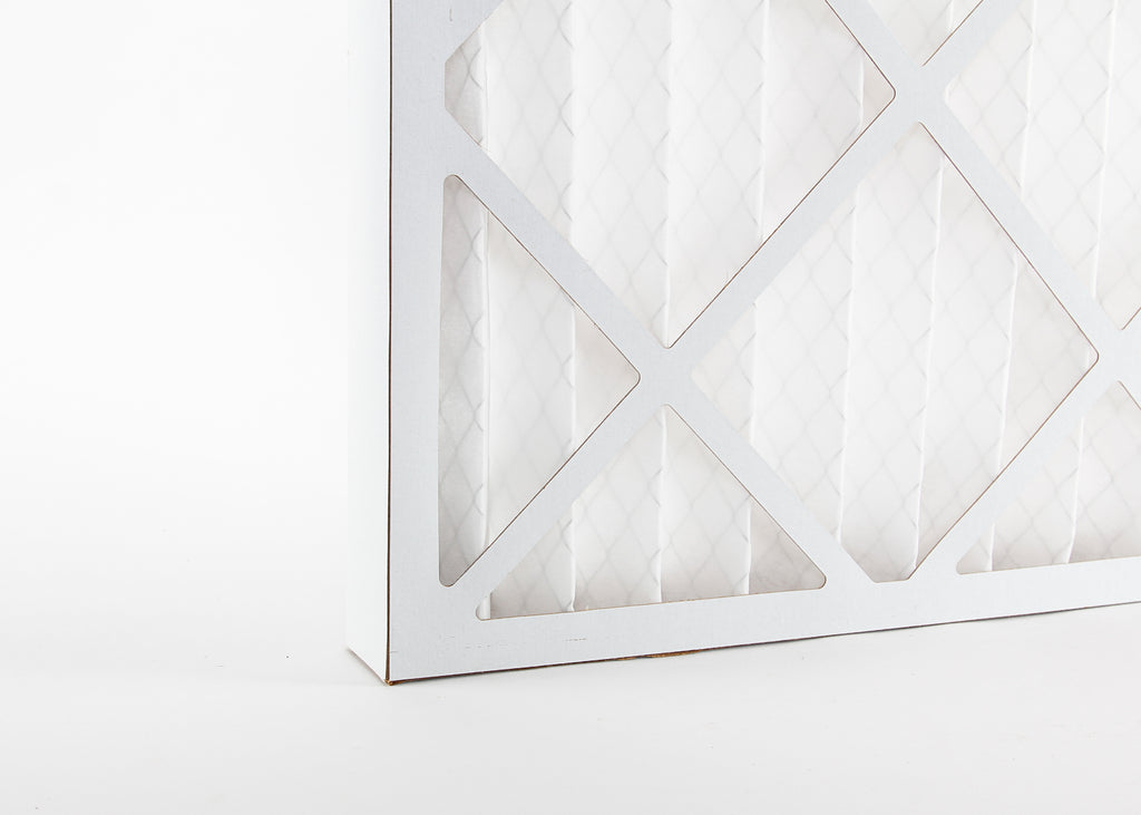 close up photo showing a pleated spray booth dust filter and its cardboard frame