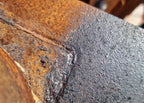 photo of a treated rusty surface showing the treated and untreated surface