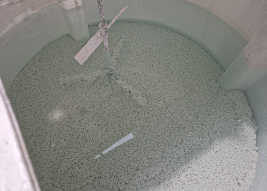 separated paint solids settled within our mixing tank before being pumped into filtration sack