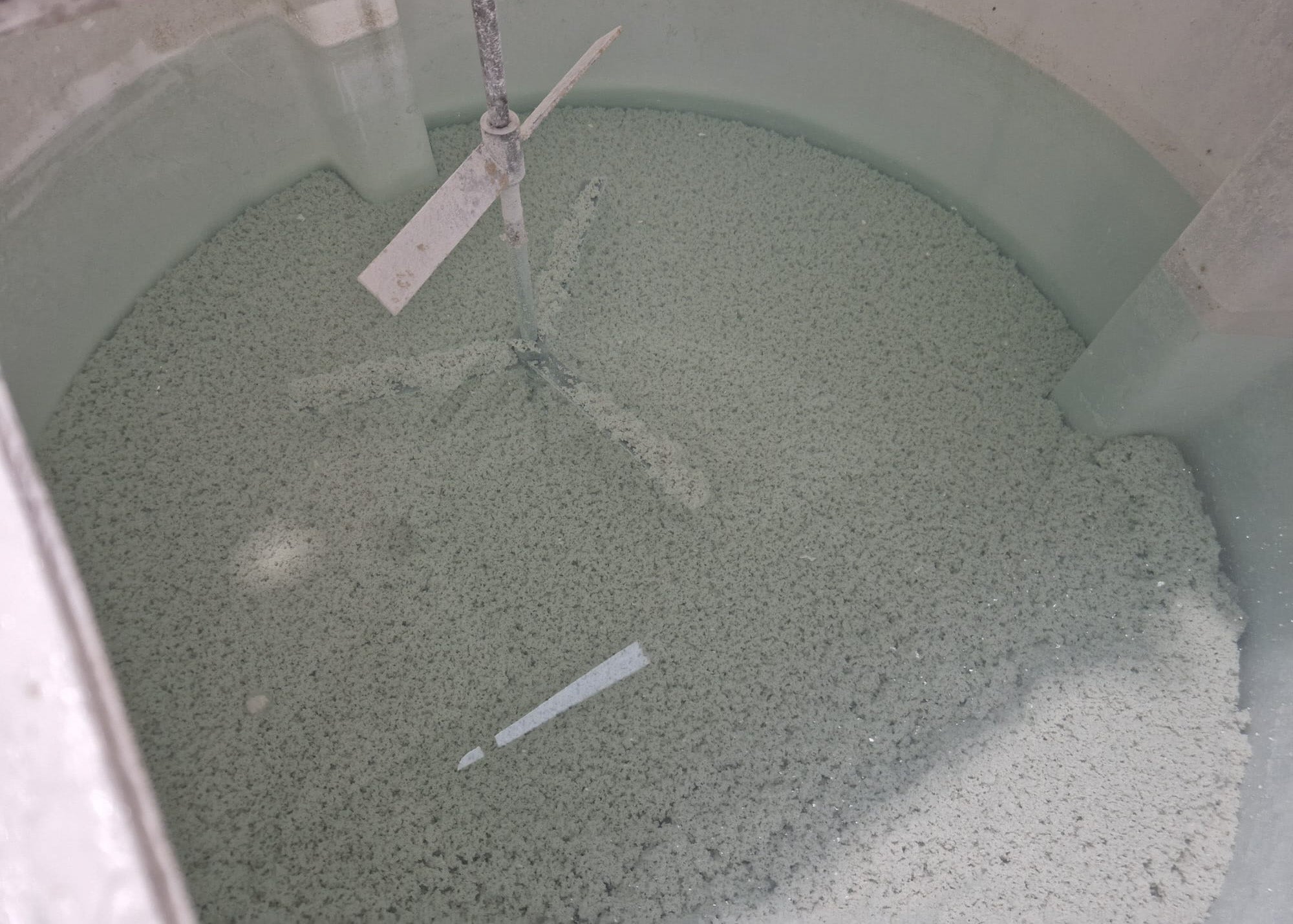 separated paint solids settled within our mixing tank before being pumped into filtration sack