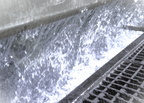 photo showing the water curtain in a wet spray booth. this water can be treated with Probio to ensure safe levels of bacteria growth are maintained.