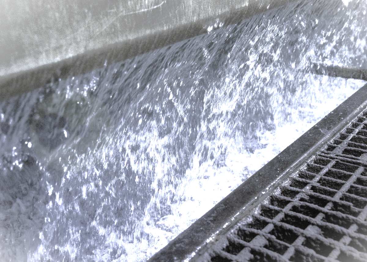 photo showing the water curtain in a wet spray booth. this water can be treated with Probio to ensure safe levels of bacteria growth are maintained.